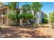 Inviting building exterior featuring mature landscaping and architectural details providing a serene and private setting at 5221 N 24Th St # 103, Phoenix, AZ 85016