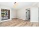 Bright dining area with wood floors and view of the outdoor patio and closet area at 5221 N 24Th St # 103, Phoenix, AZ 85016