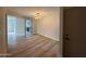 Open dining room with updated light fixture and wood-look flooring at 5221 N 24Th St # 103, Phoenix, AZ 85016