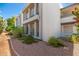 Modern condo exterior with clean lines, desert landscaping, and a textured facade at 5221 N 24Th St # 103, Phoenix, AZ 85016