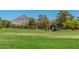 Beautiful golf course backdrop with players enjoying a round against the mountain views at 5221 N 24Th St # 103, Phoenix, AZ 85016