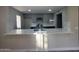 Updated kitchen features gray cabinets, stainless steel appliances, and a bright quartz countertop at 5221 N 24Th St # 103, Phoenix, AZ 85016