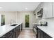 Modern kitchen with stainless steel appliances, sleek countertops, and a beautiful window view at 5221 N 24Th St # 103, Phoenix, AZ 85016