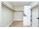 Compact laundry room with stacked washer/dryer for space-saving convenience and clean functionality at 5221 N 24Th St # 103, Phoenix, AZ 85016