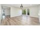 Open concept living space with ample natural light and wood floors, with great view from windows at 5221 N 24Th St # 103, Phoenix, AZ 85016