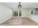 Open concept living space with ample natural light and wood floors, featuring two windows at 5221 N 24Th St # 103, Phoenix, AZ 85016