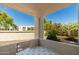 Enclosed patio with geometric tile and views of manicured plants and greenery at 5221 N 24Th St # 103, Phoenix, AZ 85016