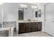 Bathroom with a double vanity and separate tub at 5423 W Michigan Ave, Glendale, AZ 85308
