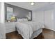 Bedroom features a soft color palette, hardwood floors, and modern furnishings for a restful retreat at 5423 W Michigan Ave, Glendale, AZ 85308