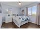 Cozy bedroom featuring cool paint, a ceiling fan, and bright window at 5423 W Michigan Ave, Glendale, AZ 85308