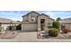 Two-story home featuring a neutral color palette, desert landscaping, a two-car garage and a tile roof at 5423 W Michigan Ave, Glendale, AZ 85308