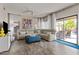 Comfortable living room area with sliding glass doors that allow lots of natural light at 5423 W Michigan Ave, Glendale, AZ 85308