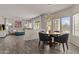 Open living space with combined dining area and sliding glass doors that allow lots of natural light at 5423 W Michigan Ave, Glendale, AZ 85308
