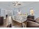 Spacious main bedroom with hardwood floors, comfortable chairs, and an adjoining sitting room at 5423 W Michigan Ave, Glendale, AZ 85308