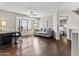 Bright sitting room with hardwood floors and a large bay window, offering a serene space for relaxation at 5423 W Michigan Ave, Glendale, AZ 85308