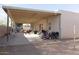 Spacious backyard with a covered patio and room for outdoor activities and play at 546 S Ellsworth Rd, Mesa, AZ 85208