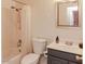 Clean bathroom featuring a shower and tub combination, neutral tile and a single sink vanity at 546 S Ellsworth Rd, Mesa, AZ 85208