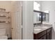 Bathroom featuring double sinks, granite counters, and plenty of storage at 546 S Ellsworth Rd, Mesa, AZ 85208