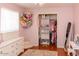 Charming bedroom with plush bedding, closet storage, and cute decorative accents at 546 S Ellsworth Rd, Mesa, AZ 85208