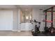 Home exercise room with weight lifting equipment, offering a convenient and private fitness space at 546 S Ellsworth Rd, Mesa, AZ 85208