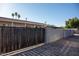 Home exterior showcasing a wood fence, block wall, and a glimpse of the home's facade at 546 S Ellsworth Rd, Mesa, AZ 85208