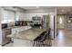 Modern kitchen with stainless steel appliances, granite island, and ample cabinet space at 546 S Ellsworth Rd, Mesa, AZ 85208