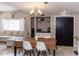 Spacious eat-in kitchen with a dining table, pantry, and ample natural light at 546 S Ellsworth Rd, Mesa, AZ 85208