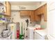 Functional laundry room with washer, dryer, water heater and ample storage shelves at 546 S Ellsworth Rd, Mesa, AZ 85208