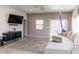 Spacious living room with modern sectional sofa and large area rug at 546 S Ellsworth Rd, Mesa, AZ 85208