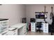 A home office space with built-in desks, storage, and guitars displayed on the wall at 546 S Ellsworth Rd, Mesa, AZ 85208