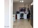 Well-equipped home office space with built-in desks, storage, and a guitar displayed at 546 S Ellsworth Rd, Mesa, AZ 85208