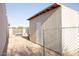 Backyard shed with a white door, located on a spacious lot and surrounded by a fence at 546 S Ellsworth Rd, Mesa, AZ 85208