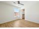 Well-lit bedroom includes a closet and a window providing natural light and charm at 7204 W Mcrae Way, Glendale, AZ 85308
