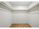 Walk-in closet with white walls and pre-installed shelving for easy organization at 7204 W Mcrae Way, Glendale, AZ 85308