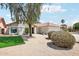 Landscaped home boasts desert landscaping, tiled roof and mature shade trees at 7204 W Mcrae Way, Glendale, AZ 85308