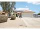Home featuring well-manicured landscaping, desert landscaping and tiled roof at 7204 W Mcrae Way, Glendale, AZ 85308