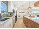 Modern kitchen featuring stainless appliances, white cabinets, and a breakfast nook at 7204 W Mcrae Way, Glendale, AZ 85308