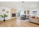 Cozy living room featuring a stone fireplace and lots of natural light at 7204 W Mcrae Way, Glendale, AZ 85308