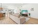 Comfortable living room with a plush sofa and views of the dining area at 7204 W Mcrae Way, Glendale, AZ 85308