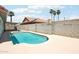 Inviting backyard swimming pool with stone pavers and block fence for added privacy at 7204 W Mcrae Way, Glendale, AZ 85308