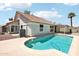 Backyard pool with a red tile roof home at 7204 W Mcrae Way, Glendale, AZ 85308