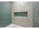 Beautiful tile shower niche is tiled in a matching tile, adding a touch of elegance at 7204 W Mcrae Way, Glendale, AZ 85308