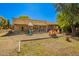 Large backyard area with playset and covered patio at 7804 S 15Th Ave, Phoenix, AZ 85041