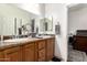 Bathroom featuring a double sink vanity and granite countertops at 7804 S 15Th Ave, Phoenix, AZ 85041