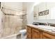 Bathroom featuring a walk-in shower, wooden vanity and granite countertop at 7804 S 15Th Ave, Phoenix, AZ 85041
