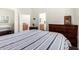 Comfortable bedroom with ensuite bathroom access and bright natural lighting at 7804 S 15Th Ave, Phoenix, AZ 85041