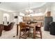 Cozy dining area adjacent to kitchen, featuring wooden table and seating at 7804 S 15Th Ave, Phoenix, AZ 85041