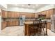 Modern kitchen boasting stainless steel appliances, granite countertops, and a central island at 7804 S 15Th Ave, Phoenix, AZ 85041