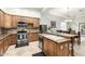 Kitchen featuring stainless steel appliances, ample cabinetry, and granite countertops at 7804 S 15Th Ave, Phoenix, AZ 85041