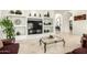 Bright living room featuring built-in shelving and modern decor accents at 7804 S 15Th Ave, Phoenix, AZ 85041